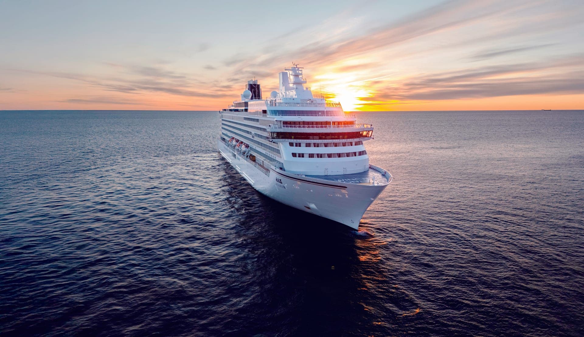 ASUKA III at sea at sunset